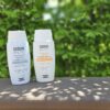 ISDIN Photo Sunscreens both tinted and untinted bottles.