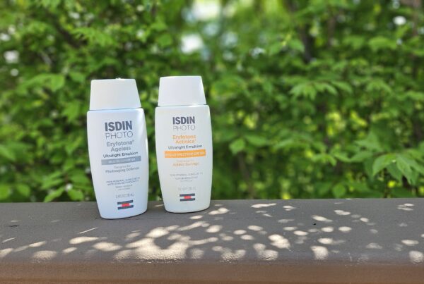 ISDIN Photo Sunscreens both tinted and untinted bottles.