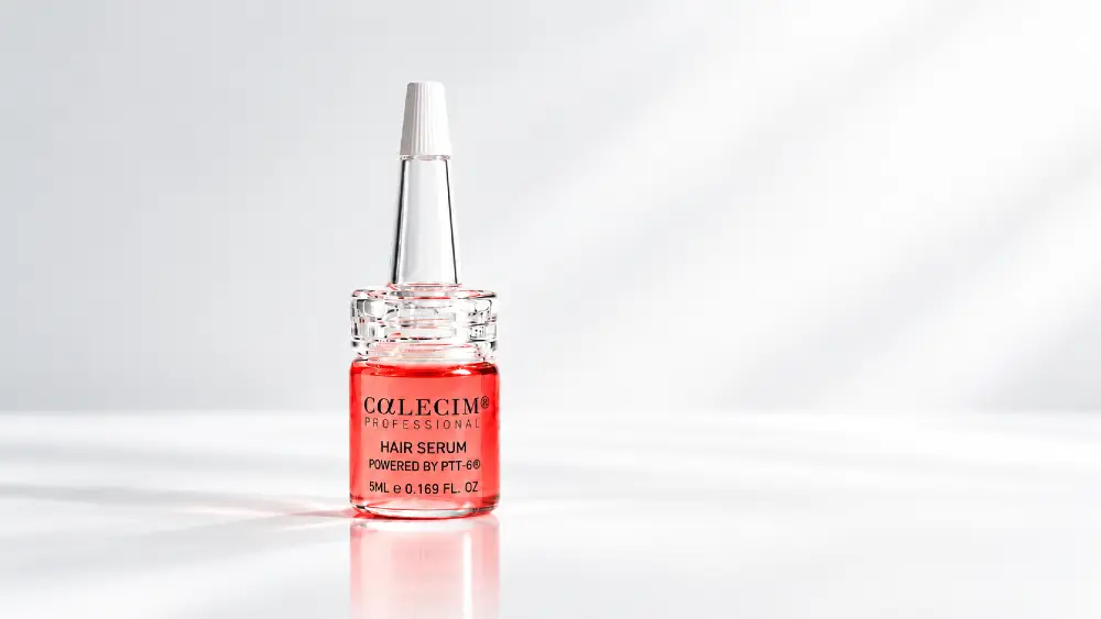 Calecim Coral Hair Serum bottle with applicator top.